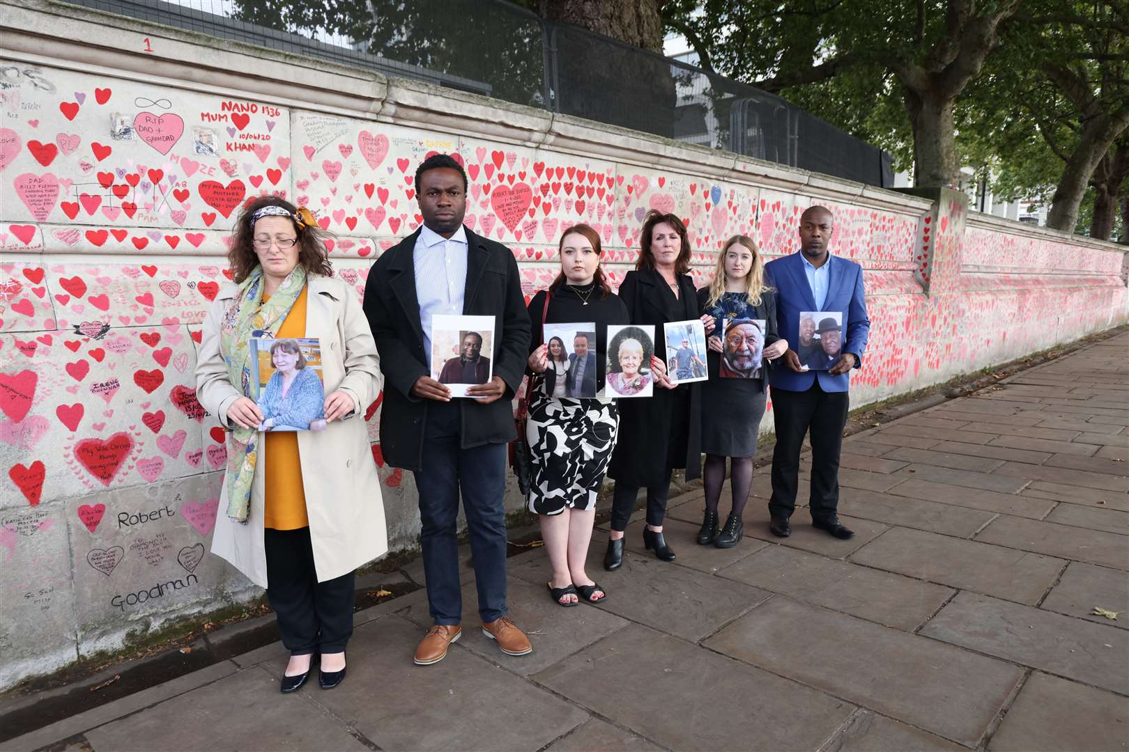 Bereaved people at the memorial wall (James Manning/PA)