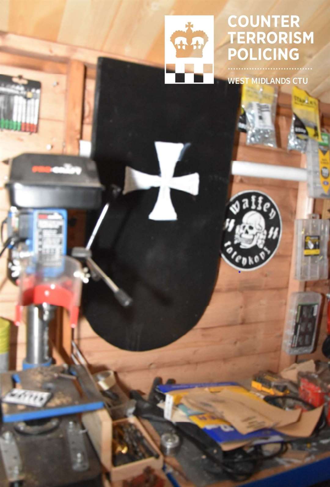 Vaughn Dolphin’s shed, showing a homemade shield and the Waffen-SS totenkopf skull and crossbones on display (West Midlands Police/PA)