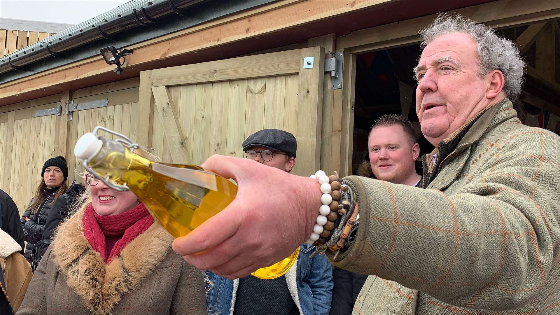 Jeremy Clarkson raffling water outside The Squat Shop, on his farm, Diddly Squat, near Chipping Norton in the Cotswolds which he is running as part of an Amazon Prime show called I Bought A Farm (Blackball Media/PA)