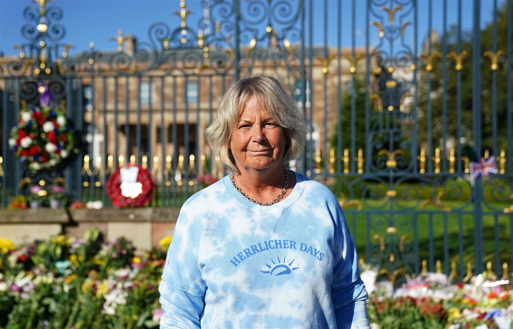 Janice Wallace, from Annahilt, at the gates of Hillsborough Castle (Brian Lawless/PA)