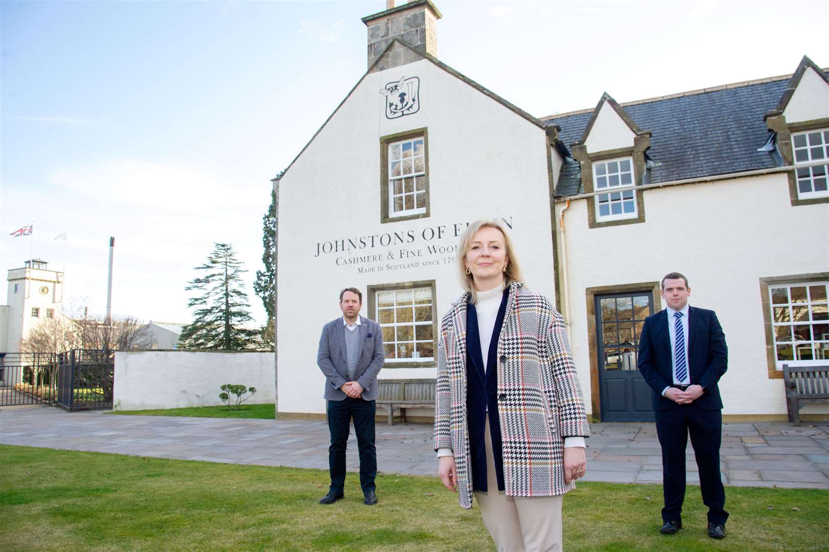 Liz Truss in Moray in March last year along with Douglas Ross and (left) Simon Cotton, the former chief executive at Johnstons of Elgin. Picture: Daniel Forsyth.