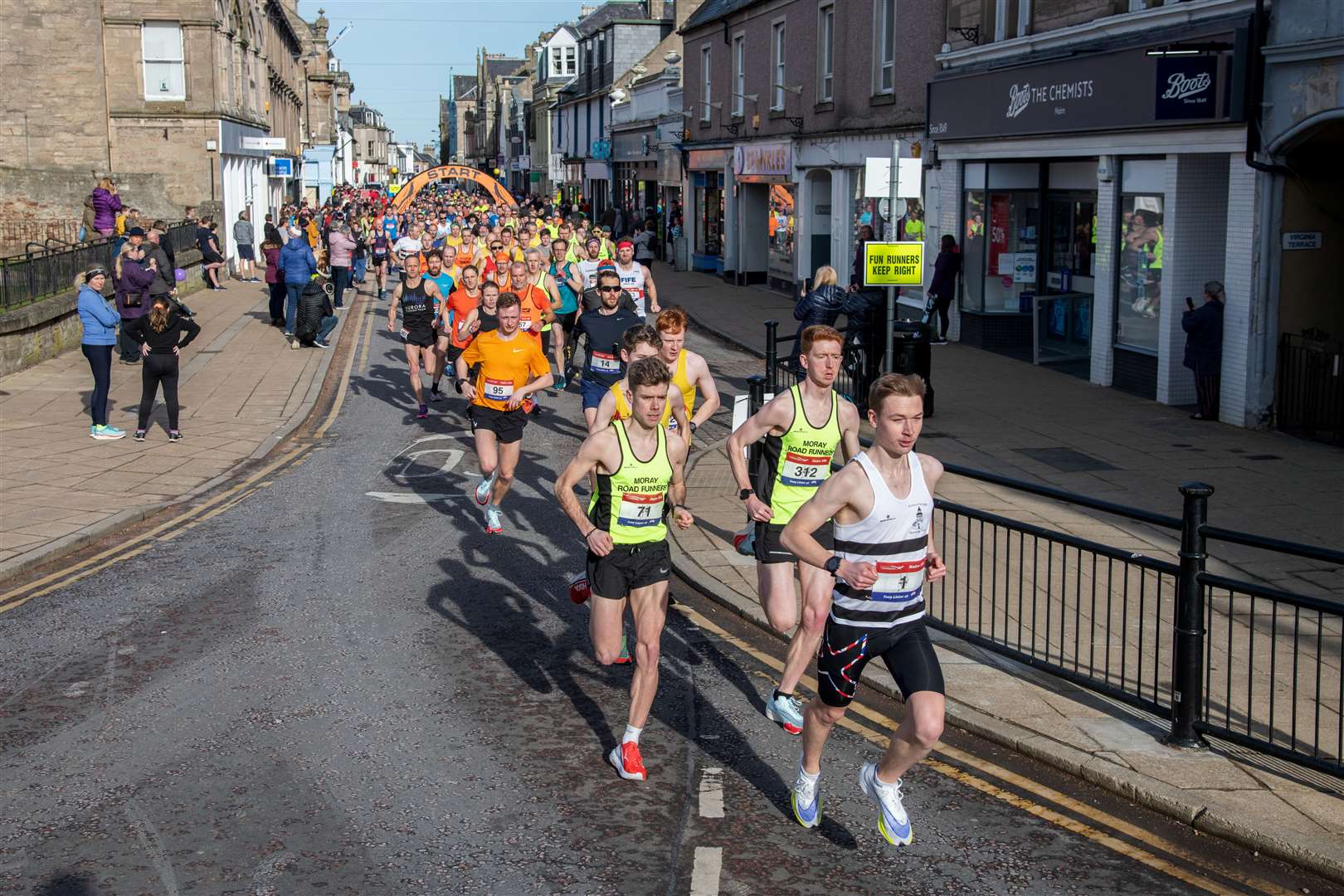 The early leaders head out from Nairn High Street. Picture: Daniel Forsyth..