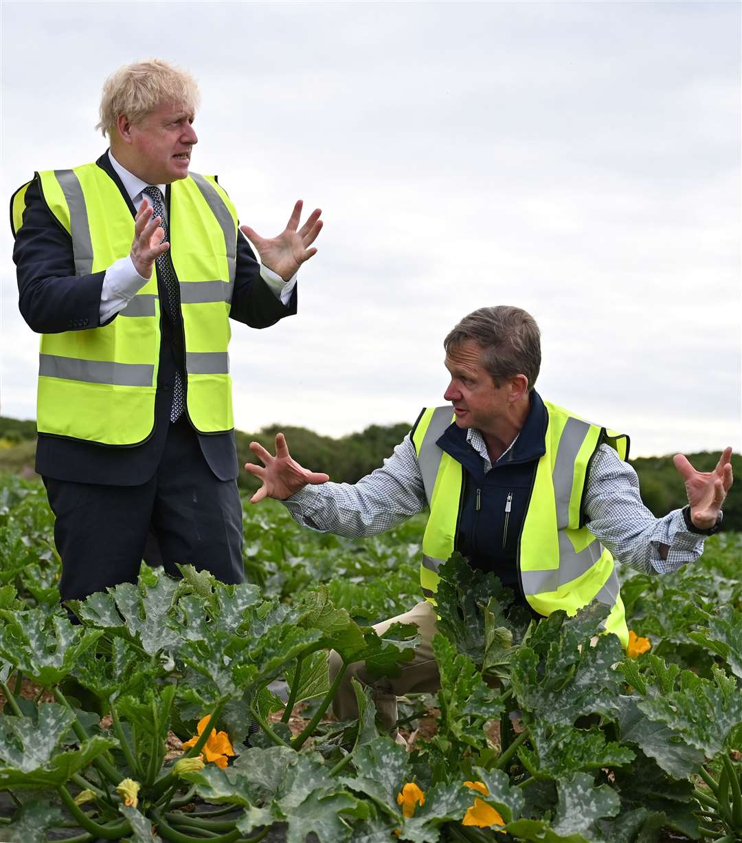Boris Johnson talks to farm manger Gordon Stokes during a visit to Southern England Farms in Cornwall, ahead of the publication of the UK government’s food strategy white paper (Justin Tallis/PA)
