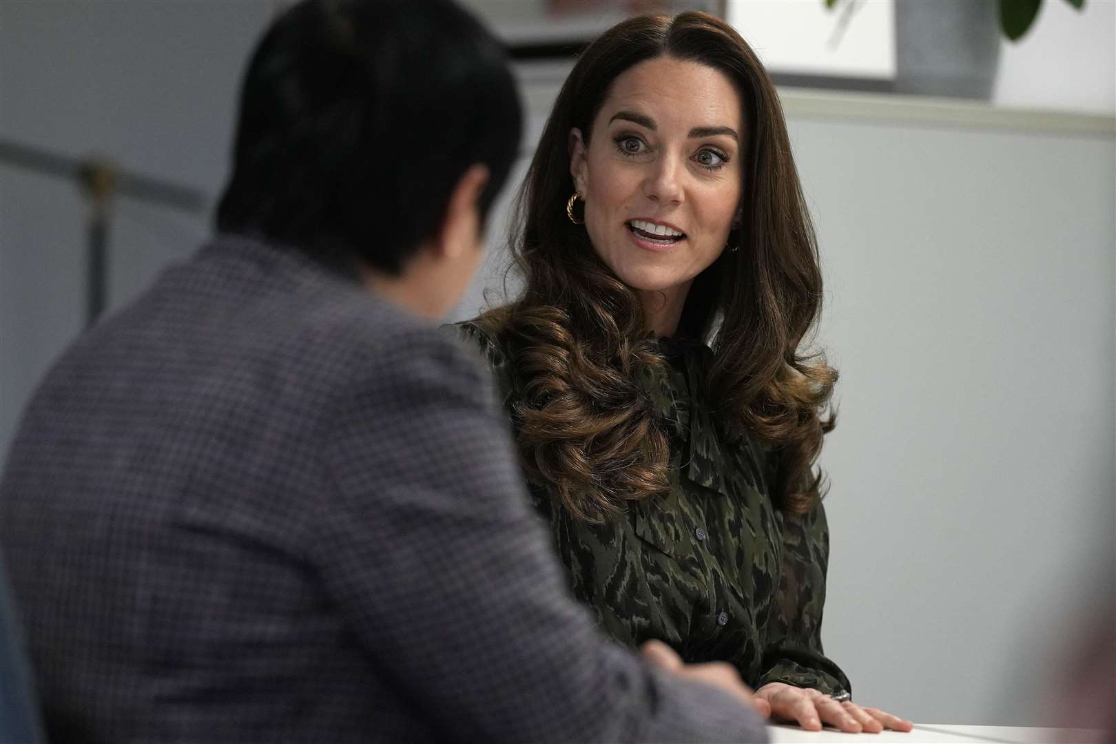 The Duchess of Cambridge speaks to members of staff during a visit to Shout in London (Alastair Grant/PA)