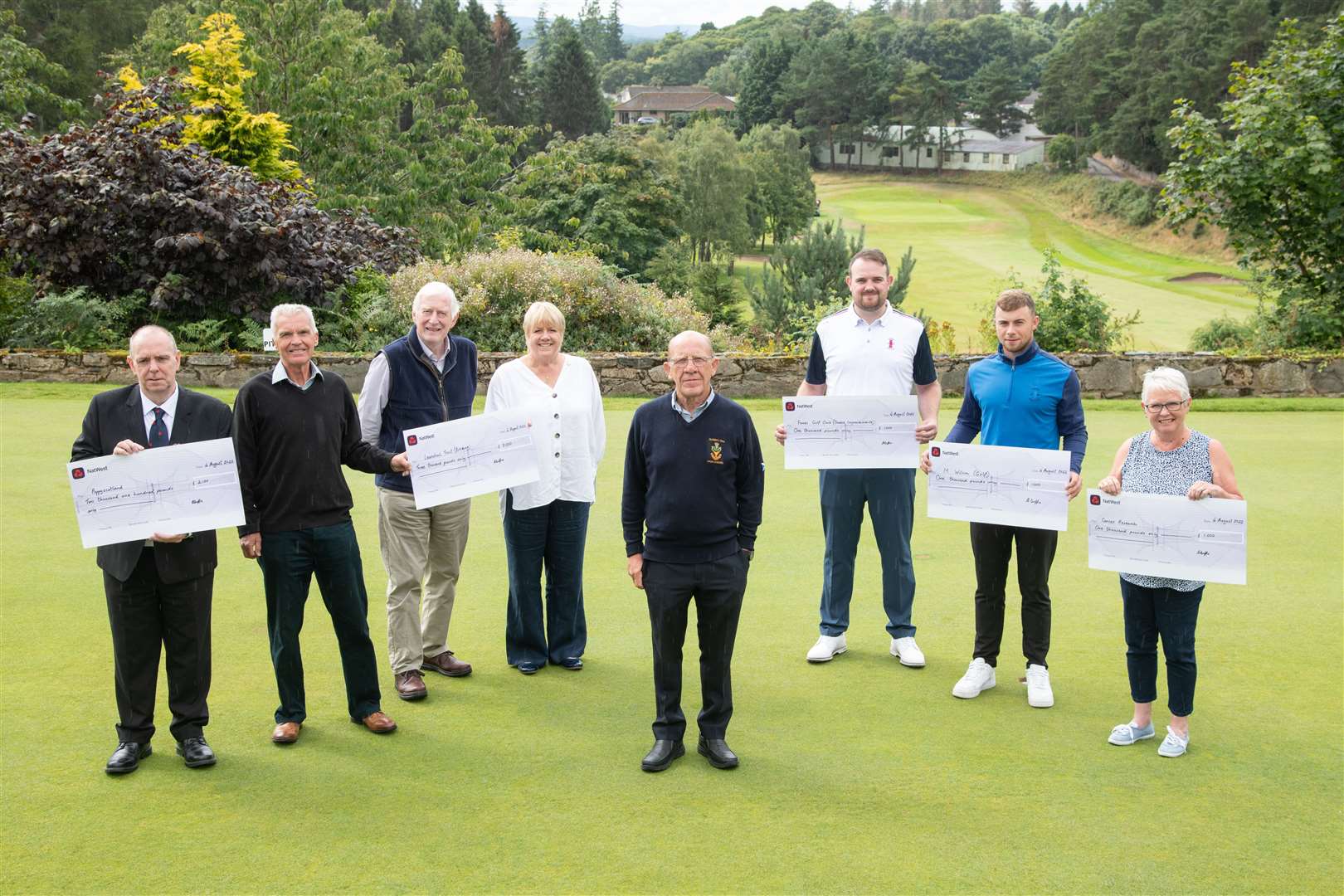 Michael Jamieson (Poppy Scotland), Graham Hilditch, Seymour Munro and Jo Lenihan (Leanchoil Trust), Albert Duffus, Sean Blacklaw (Forres Golf Club), Matty Wilson (amateur golfer) and Sheena Duffus (on behalf of Cancer Research).