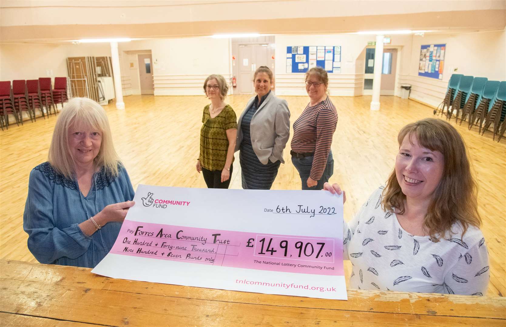 FACT employees Janice Cooper, Shirley Barr, Caroline Purves, Debbie Herron and Lindsey Standring with a cheque from the National Lottery Community Trust. Picture: Daniel Forsyth