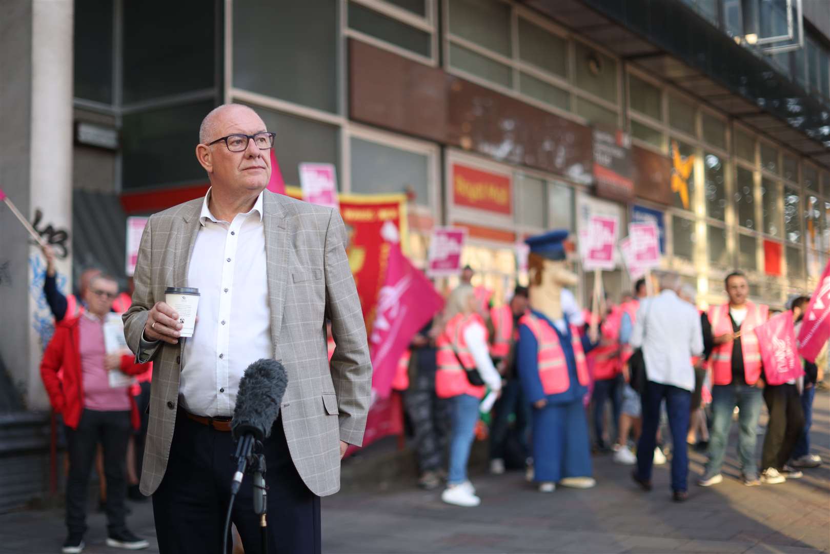 Communication Workers Union (CWU) general secretary Dave Ward speaking to the media as he joins postal workers on the picket line at the Royal Mail Whitechapel Delivery Office in east London (James Manning/PA)
