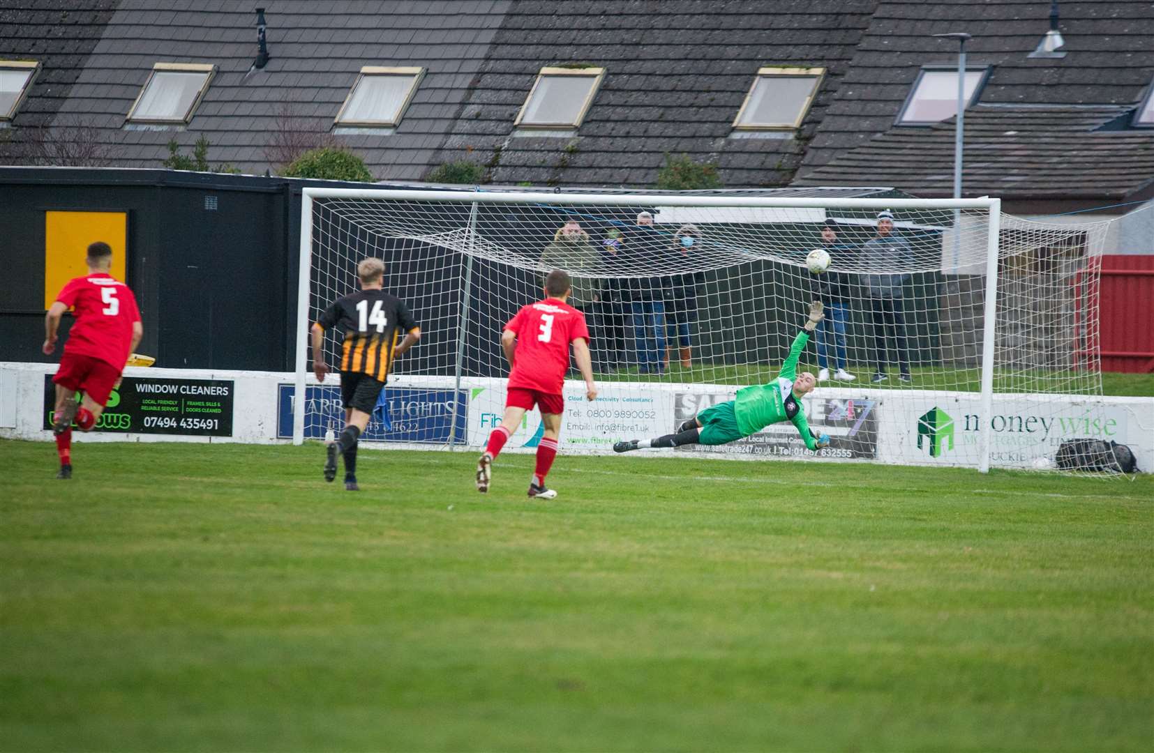 Gary McGowan scores a penalty in Huntly's 2-2 draw at Lossiemouth. Picture: Becky Saunderson..