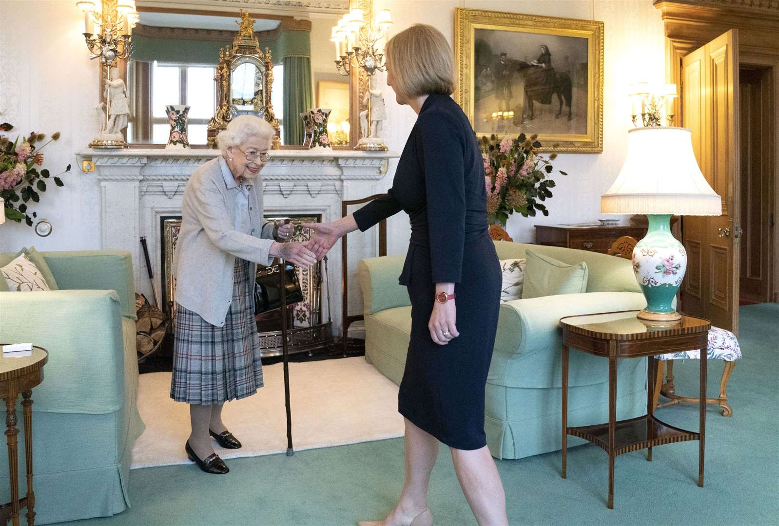 The late Queen welcoming Liz Truss during her final official engagement at Balmoral (Jane Barlow/PA)