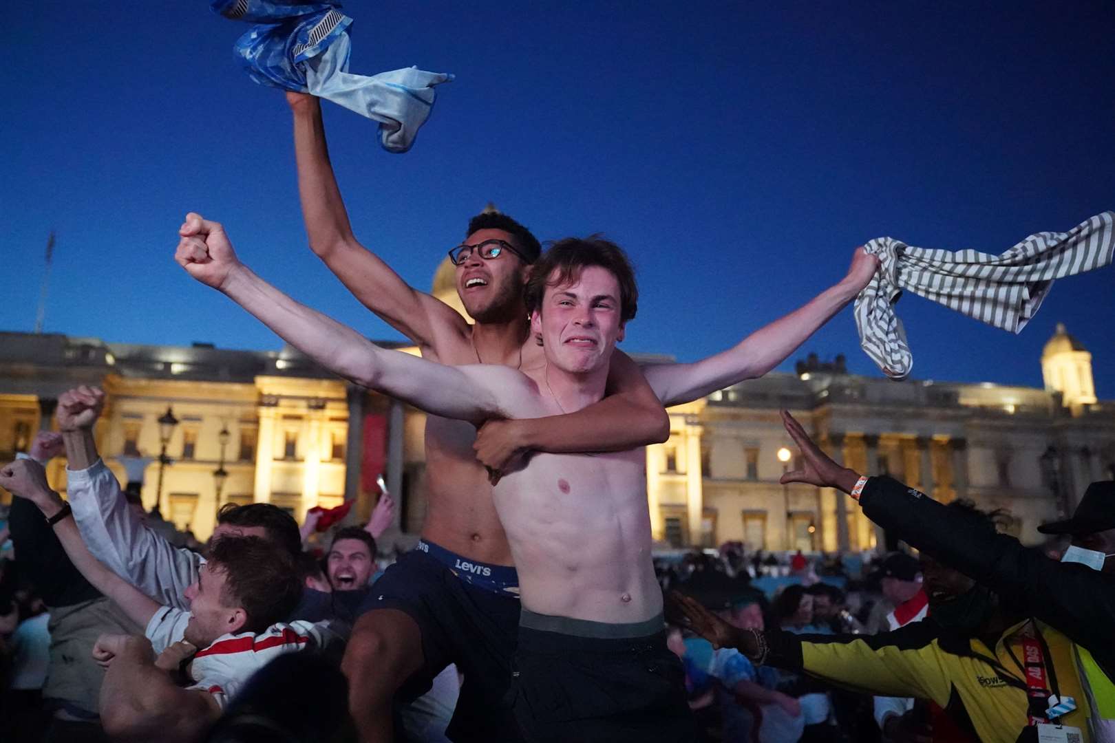Fans in Trafalgar Square celebrating England’s second goal against Denmark on Wednesday (Kirsty O’Connor/PA)