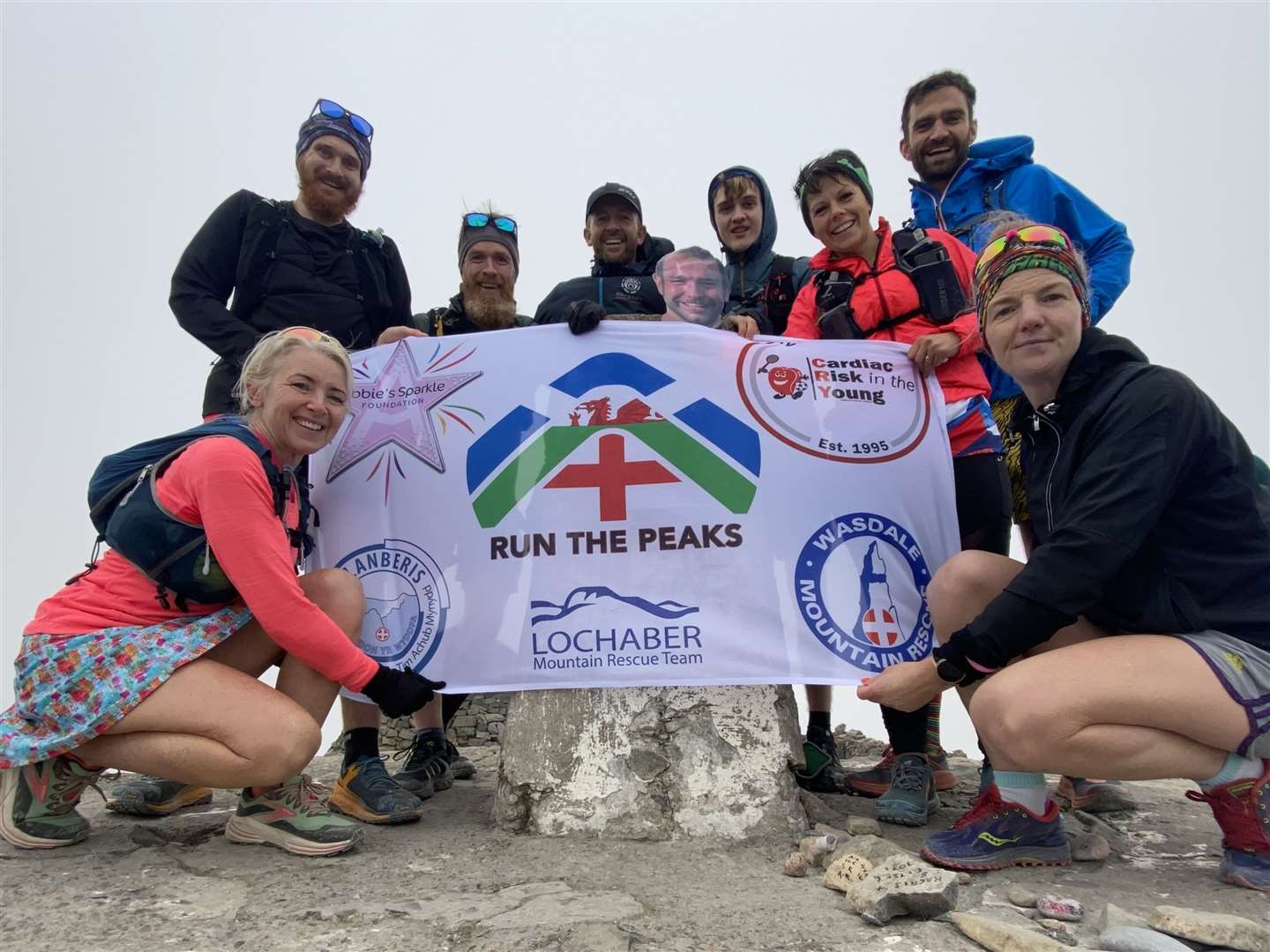 Team Run The Peaks Mike Munro (2nd left), Andy Bentley (4th left), Lori MacPherson (3rd right) and Jonny McAllister (2nd right) were accompanied by friends for the final climb at Ben Nevis which marked the end point of their mammoth challenge.
