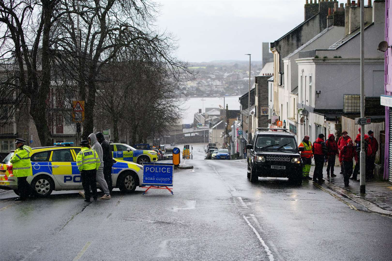 Emergency workers gather near the Torpoint Ferry crossing in Plymouth where a suspected Second World War explosive device will be taken to be disposed of at sea (Ben Birchall/PA)