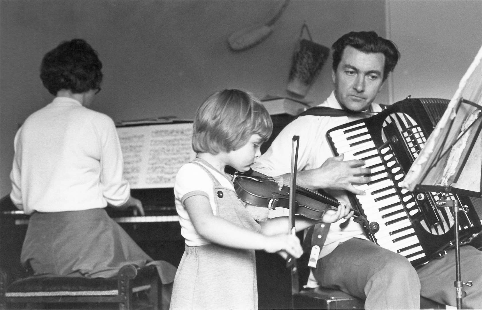 Family trio Edith, Carol and Drummond practising together.