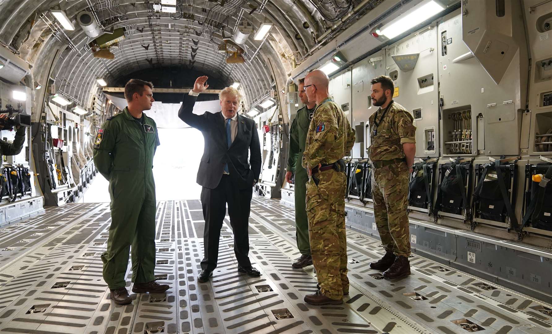 Prime Minister Boris Johnson, speaks with military personnel on board a C17 at RAF Brize Norton in Oxfordshire the day after his visit to Kyiv (Joe Giddens/PA).