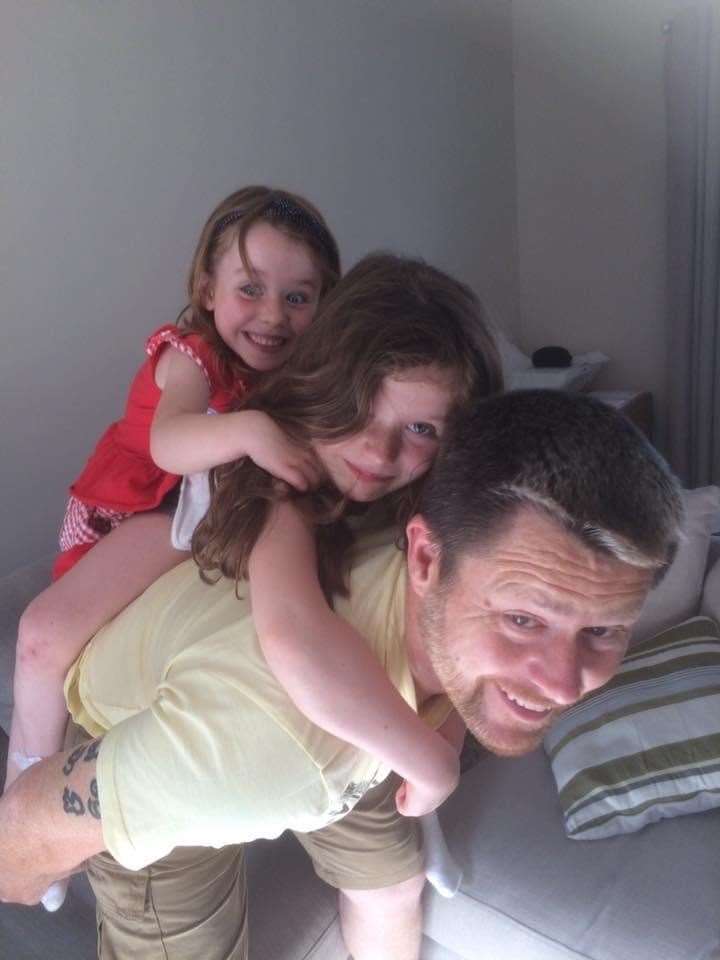 Matt Horsburgh with his two daughters, Isabelle (left) and Charlotte (Cancer Research UK/PA)