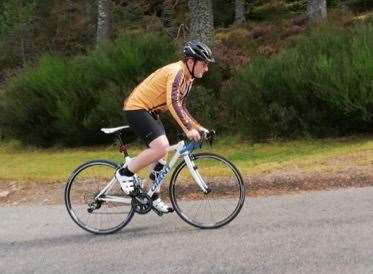 Gillies taking on another hill while racking up the mileage.