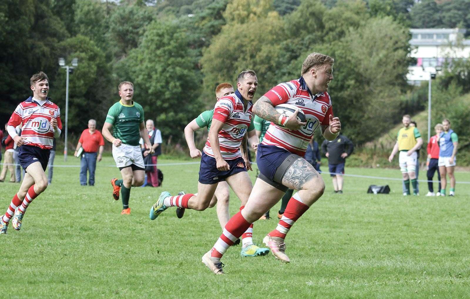 Lewis Scott runs in score a try. In support are Lewis Hay and Cameron Ireland. Picture: John MacGregor