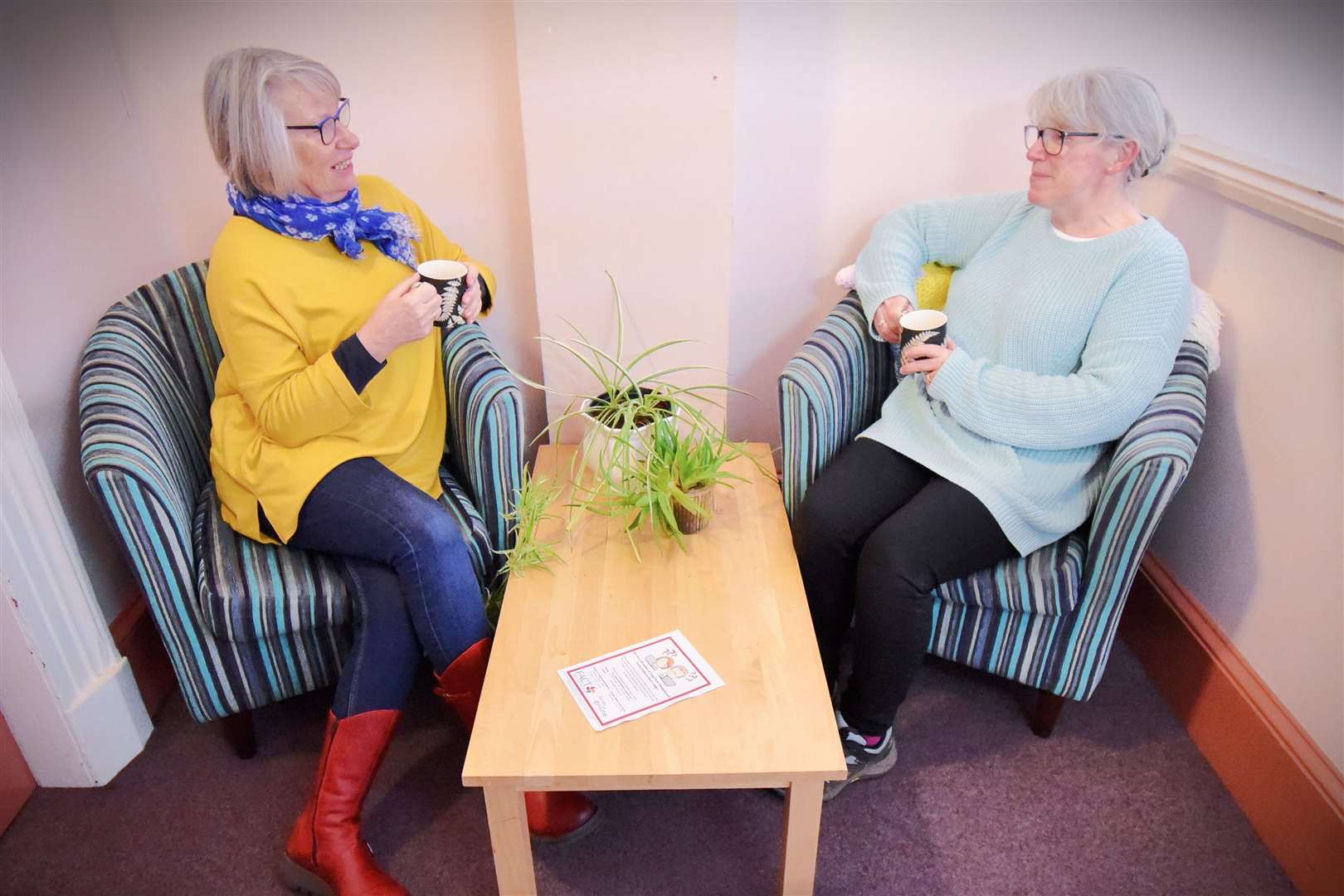 Sally Lusk and Lorretta Oliphant enjoying each other’s company at Forres Town Hall.