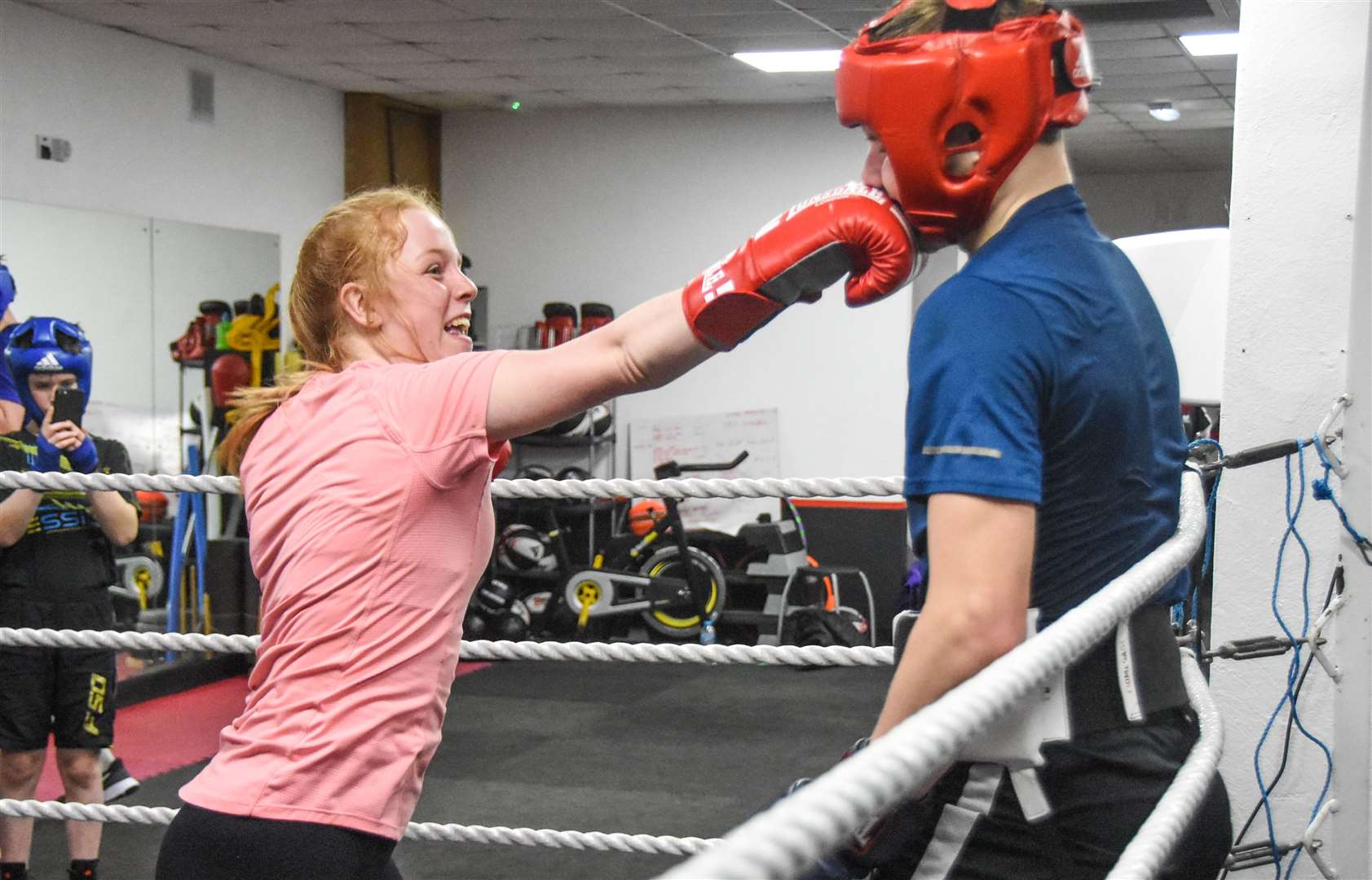 Landing a right hook on fellow Rothes boxer Corey Rizza is Chloe Quinn at the Elgin Boxing Club all-female session. Picture: Becky Saunderson..