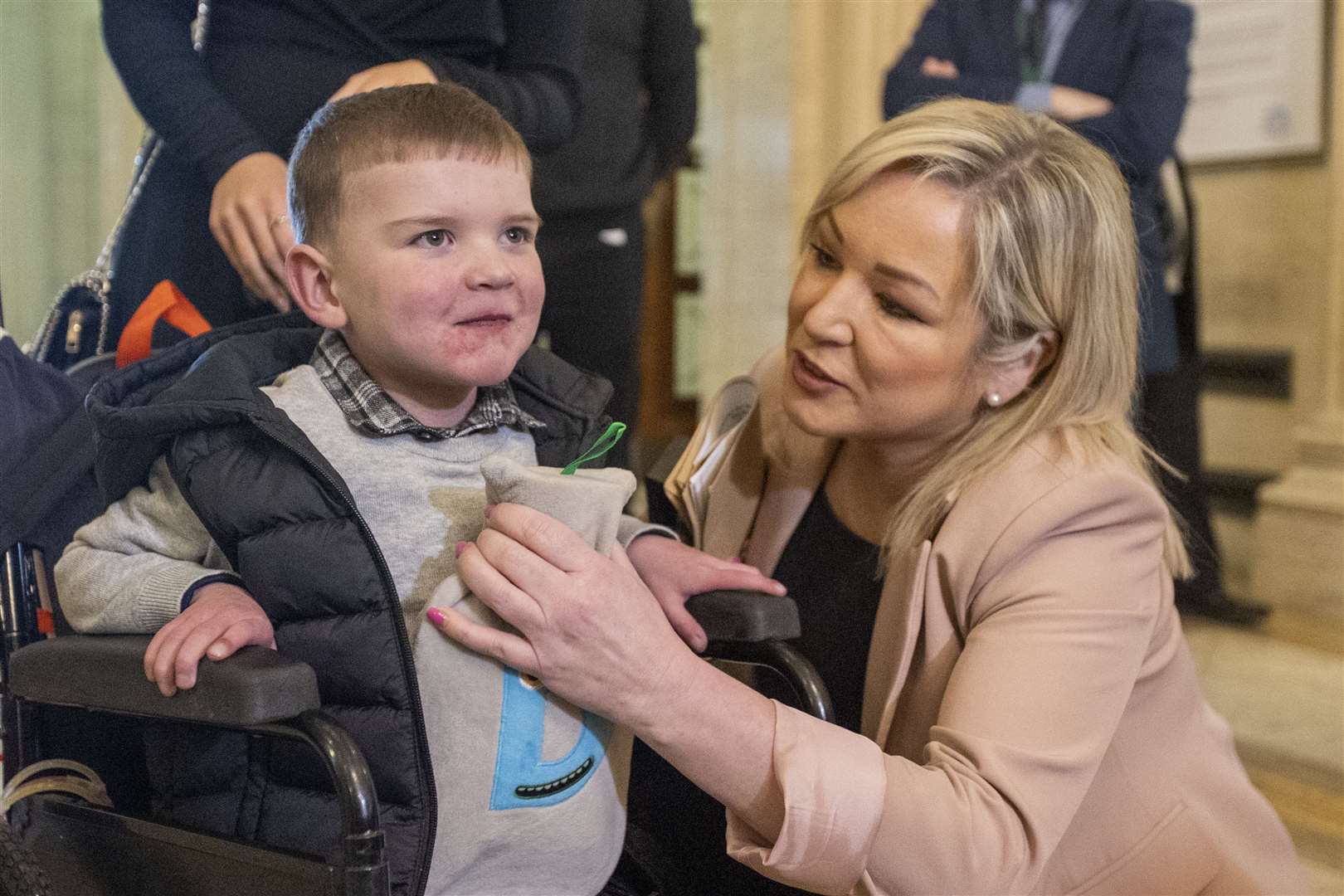 Sinn Fein Vice President Michelle O’Neill meets six-year-old Daithi Mac Gabhann in the Great Hall of Parliament Buildings at Stormont (Liam McBurney/PA)