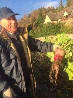Bert having a laugh with a giant radish he found while clearing flower beds on St Leonard's Road.