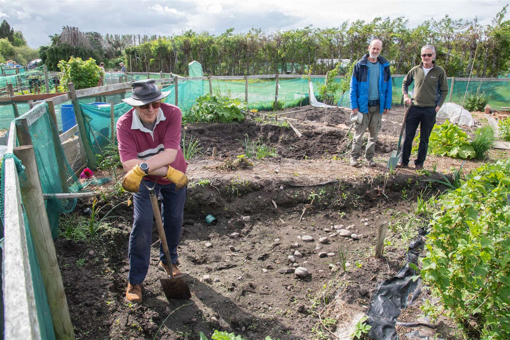 Members of Transition Town Forres working in the community garden.