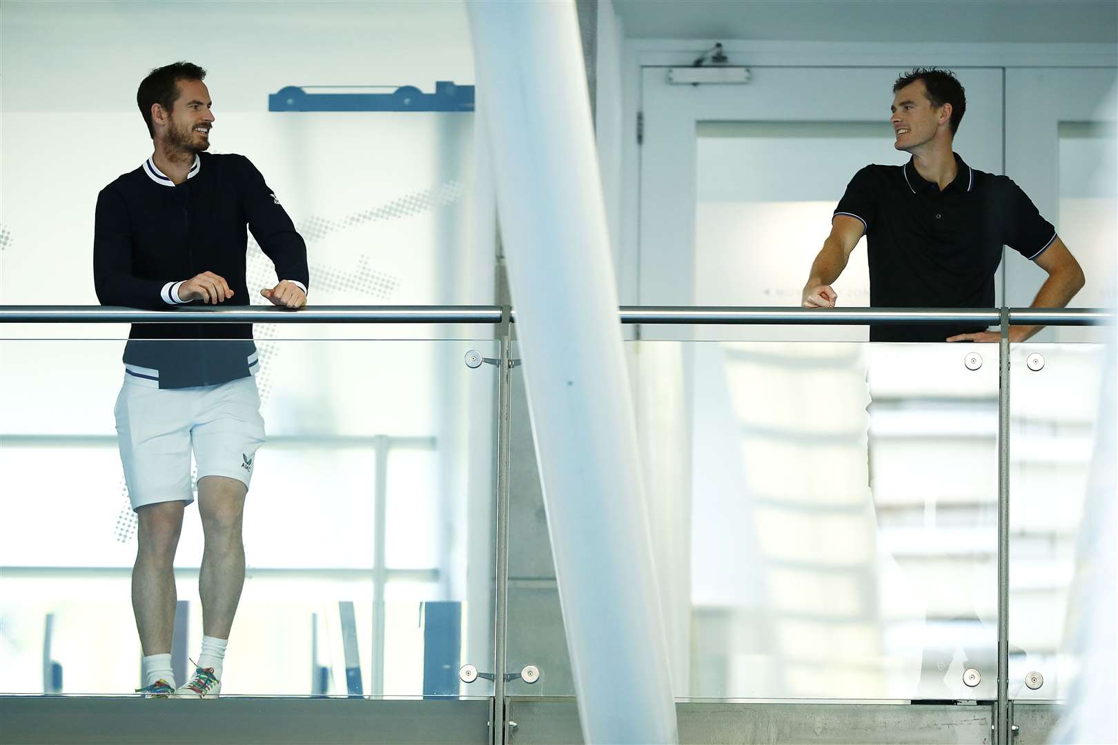 Sir Andy Murray and brother Jamie socially distance as they chat on the player's balcony during practice for the Schroders Battle of the Brits at the National Tennis Centre on June 22, 2020 in London. Photo by Clive Brunskill/Getty Images for Battle Of The Brits.