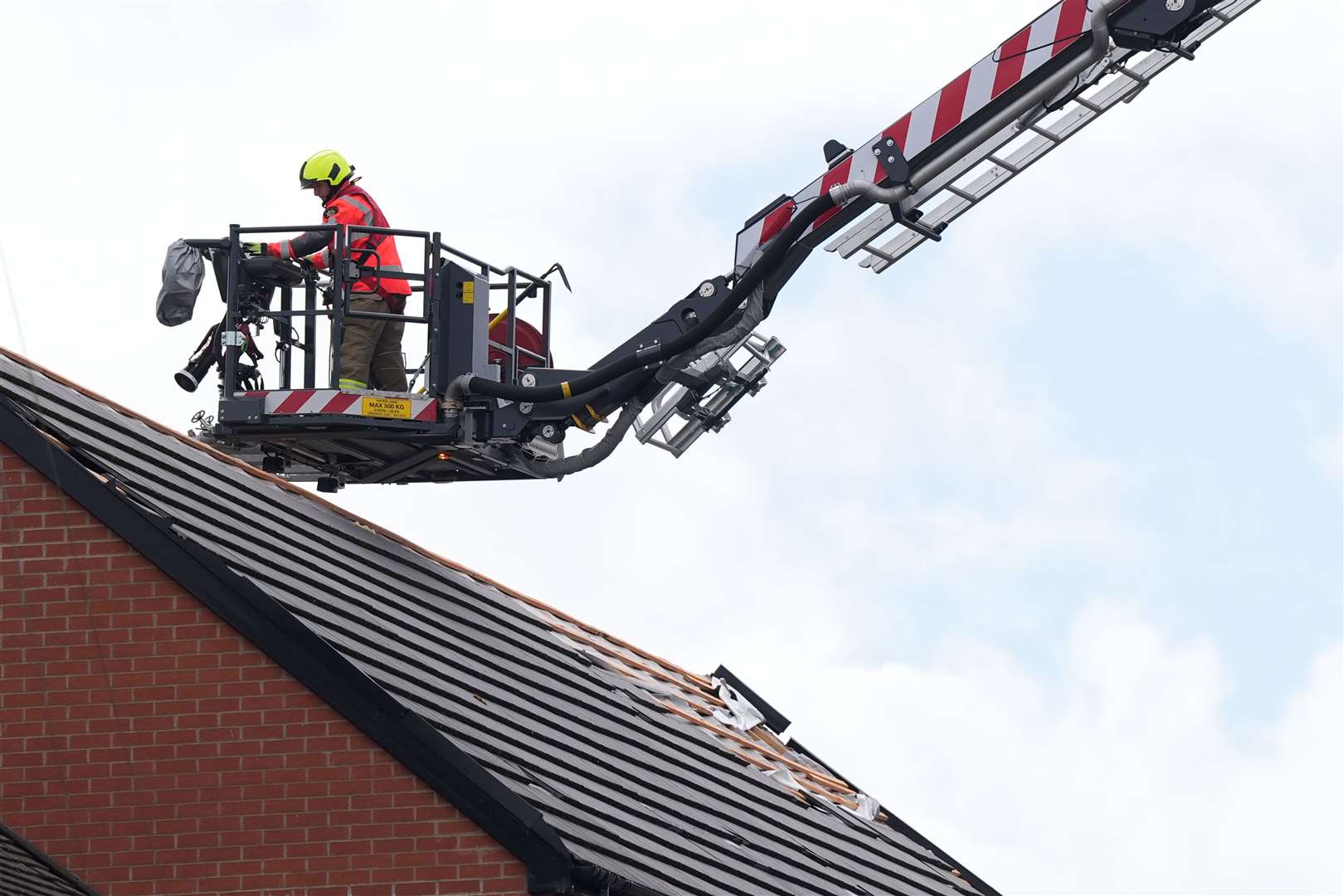 Firefighters have been making homes safe after strong winds sent tiles and chimney pots flying (Jacob King/PA)