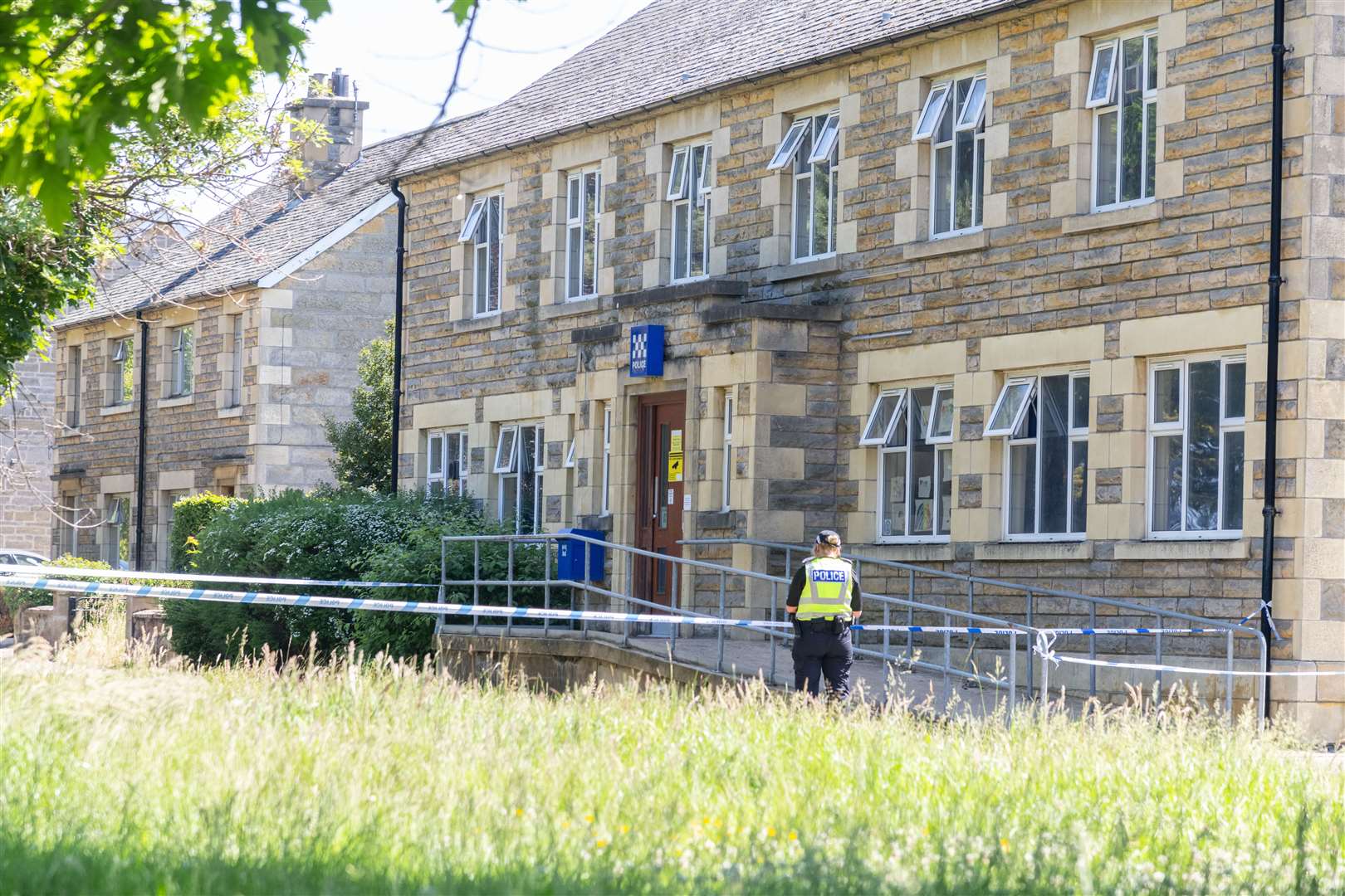 A policewoman keeps guard at Forres Police Station..Picture: Beth Taylor.