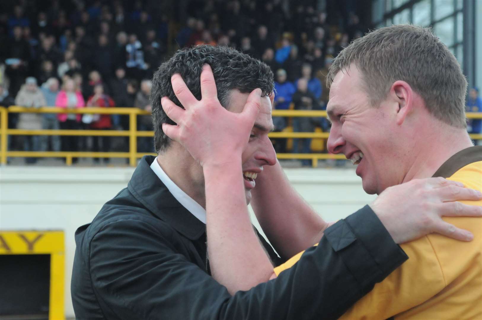Nathan Sharp (right) celebrates Forres Mechanics’ title triumph with boss Charlie Rowley in 2012. Now Sharp has returned as Rowley’s assistant. Photo: Eric Cormack.