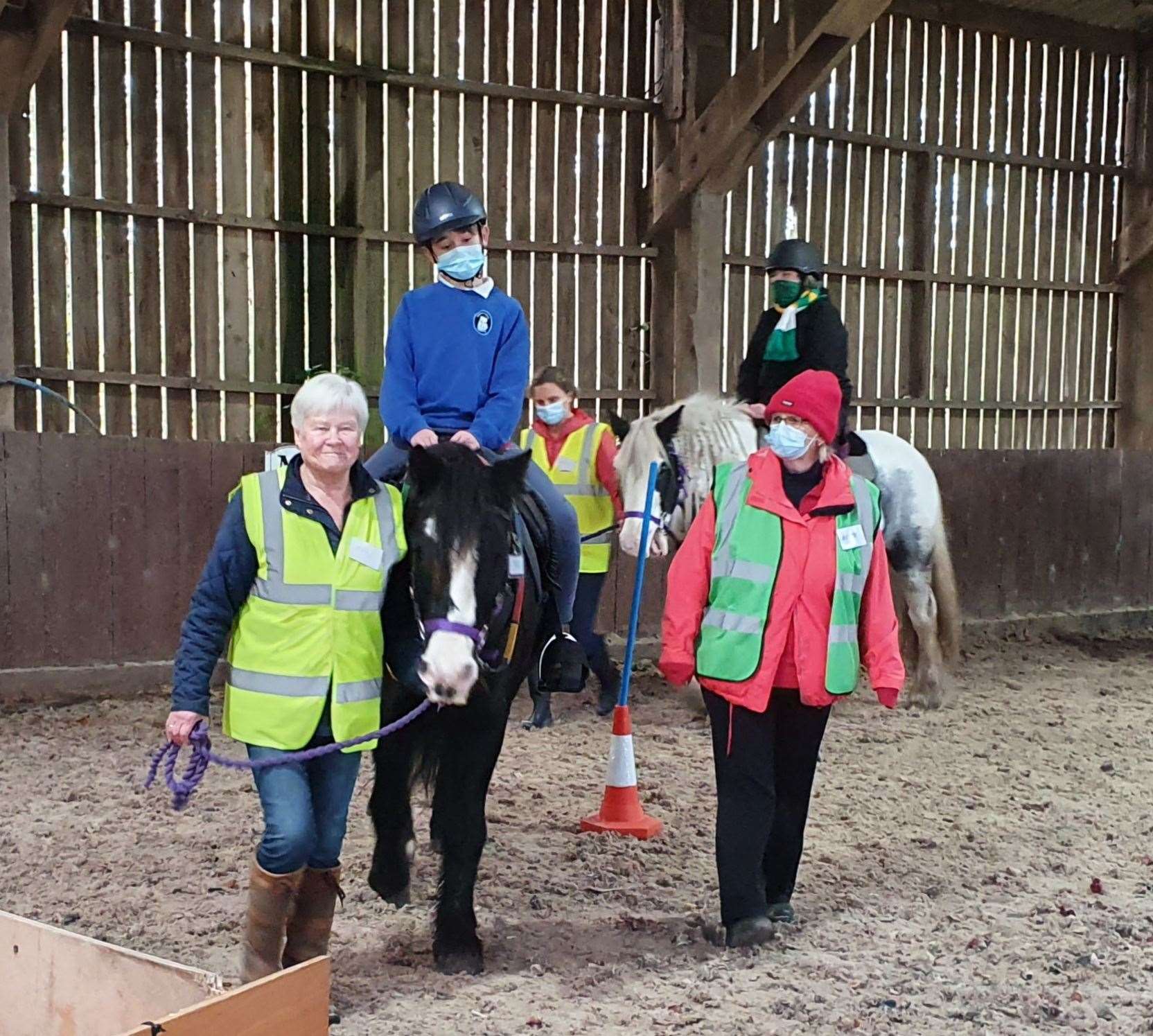 Volunteers and riders with Forres, Nairn and District Riding for the Disabled Association.