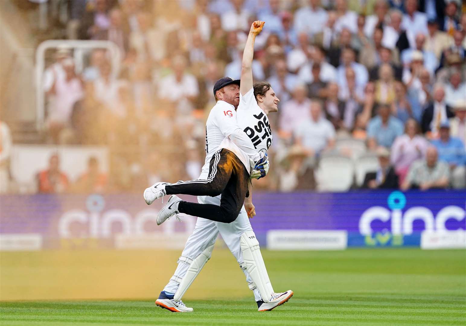 England cricketer Jonny Bairstow removes a Just Stop Oil protester from the pitch during the second Ashes test match at Lord’s (Mike Egerton/PA)