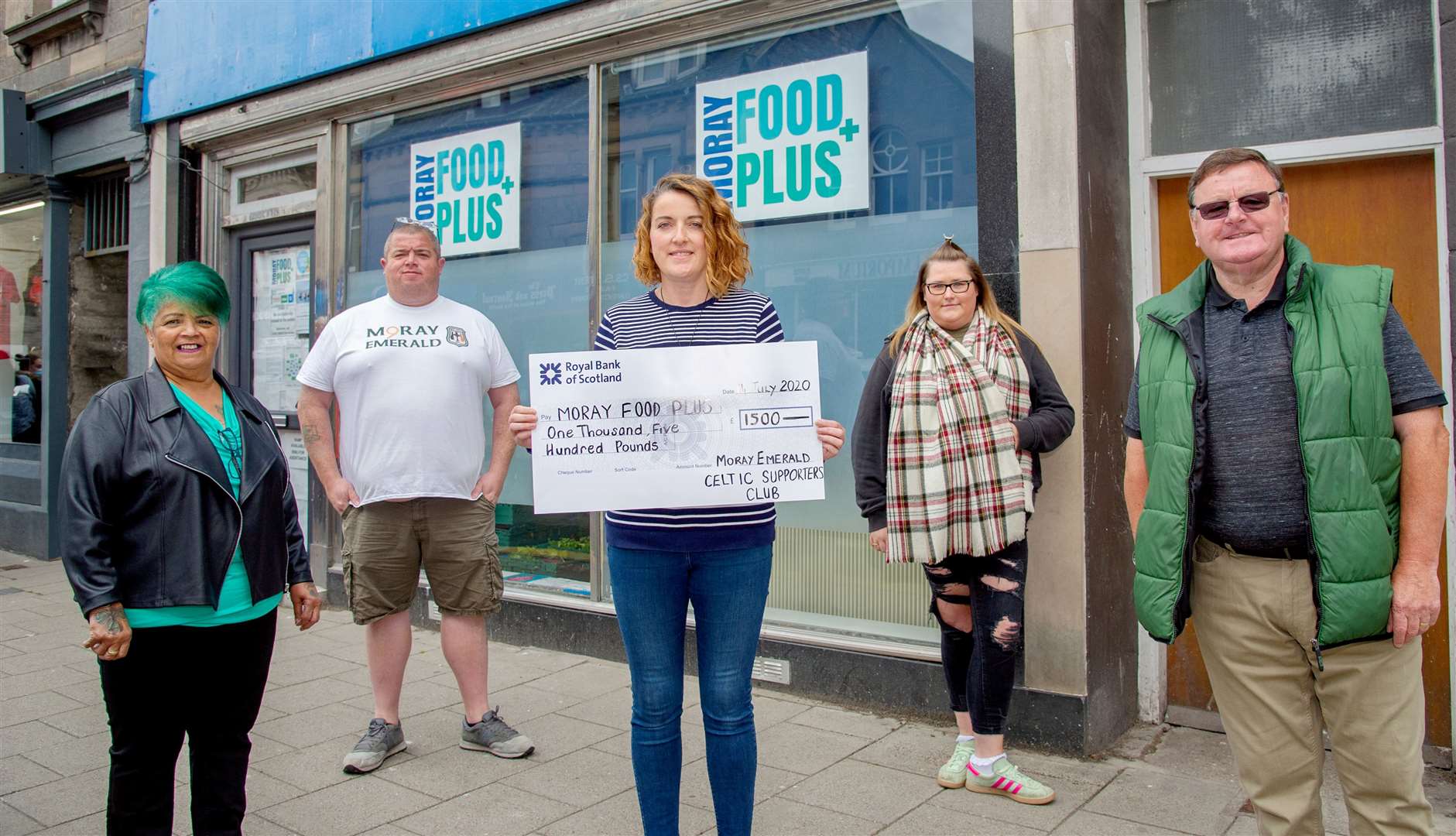 Gillian Pirie, of Moray Food Plus, receives a cheque for Â£1500 from (left to right) Caroline Anderson, Brendan Anderson, Keeley Millar and Billy Corbett on behald of the Moray Emerald Celtic Supporters Club...Picture: Daniel Forsyth..