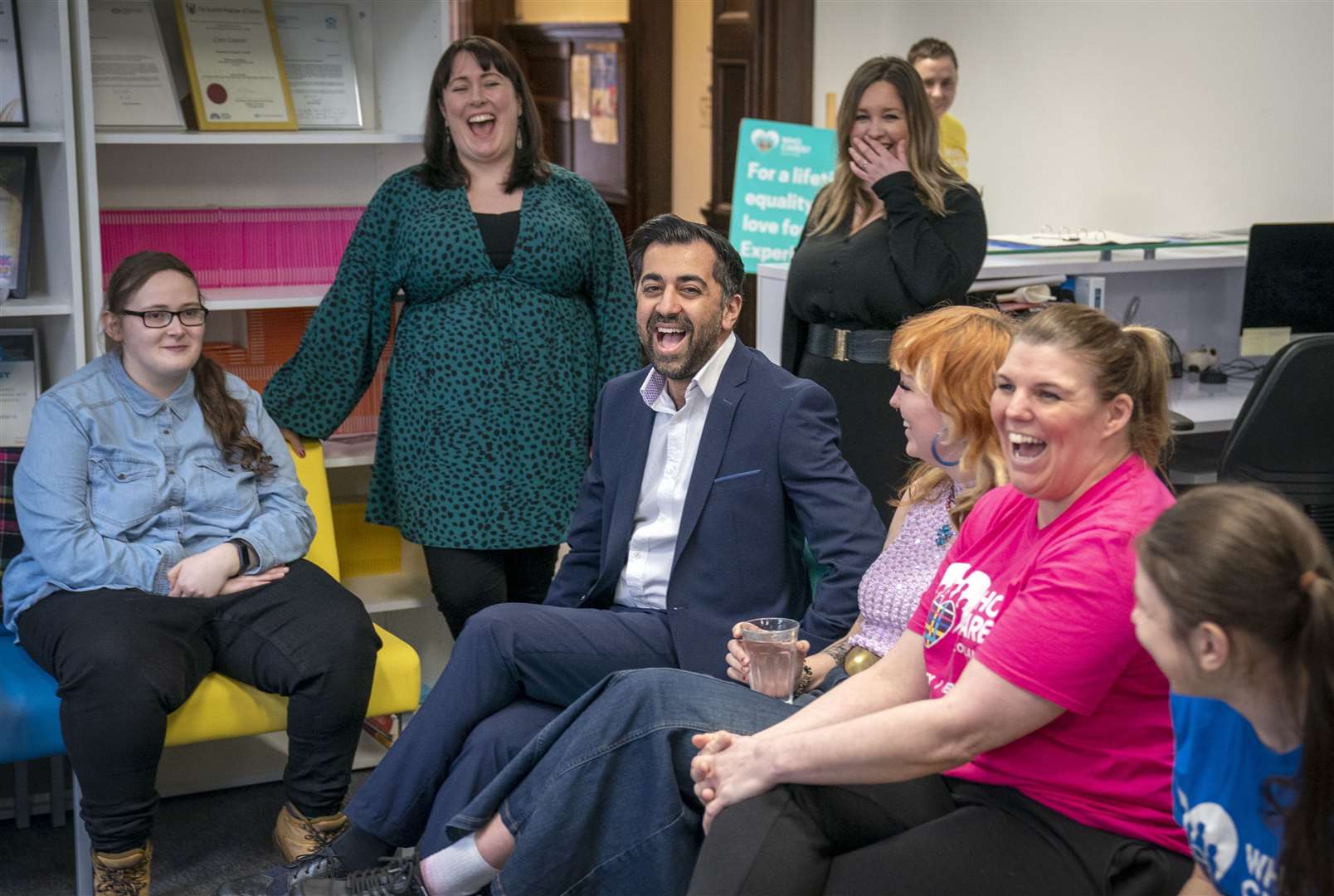 Humza Yousaf has a laugh with volunteers at Who Cares? Scotland in Glasgow (Jane Barlow/PA)
