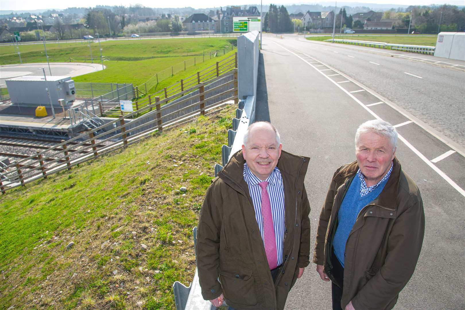 Alan James (Left) and Mike Miller - at the new railway bridge in Forres which demonstrates how high the A96 dualling section will have to be. ..Picture: Daniel Forsyth. Image No.043723.