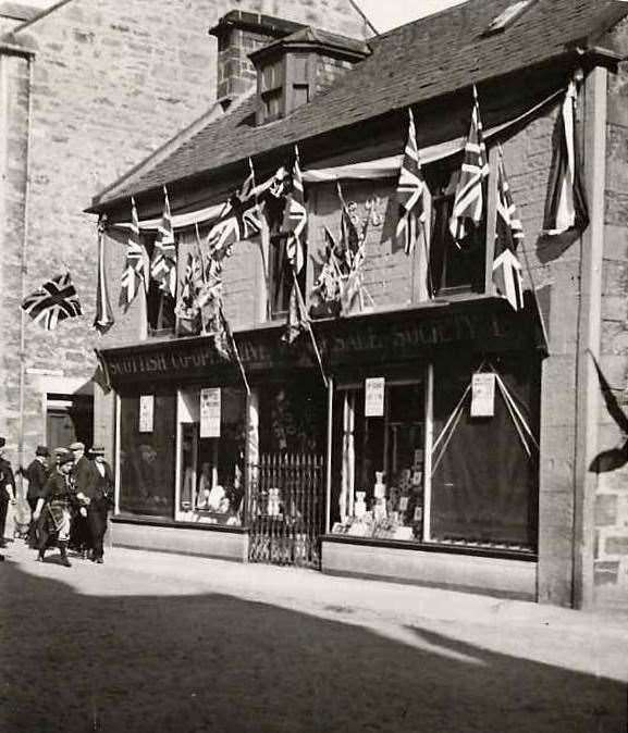 Cooperative Shop, next to the Commercial Hotel, decorated for Coronation of George VI , May 12, 1937.