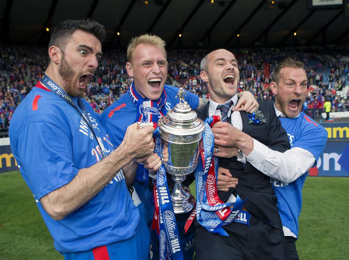 Ross Draper (left) with Carl Tremarco, David Raven, and Gary Warren celebrating Caley Thistle's 2015 Scottish Cup triumph. Picture - Ken Macpherson