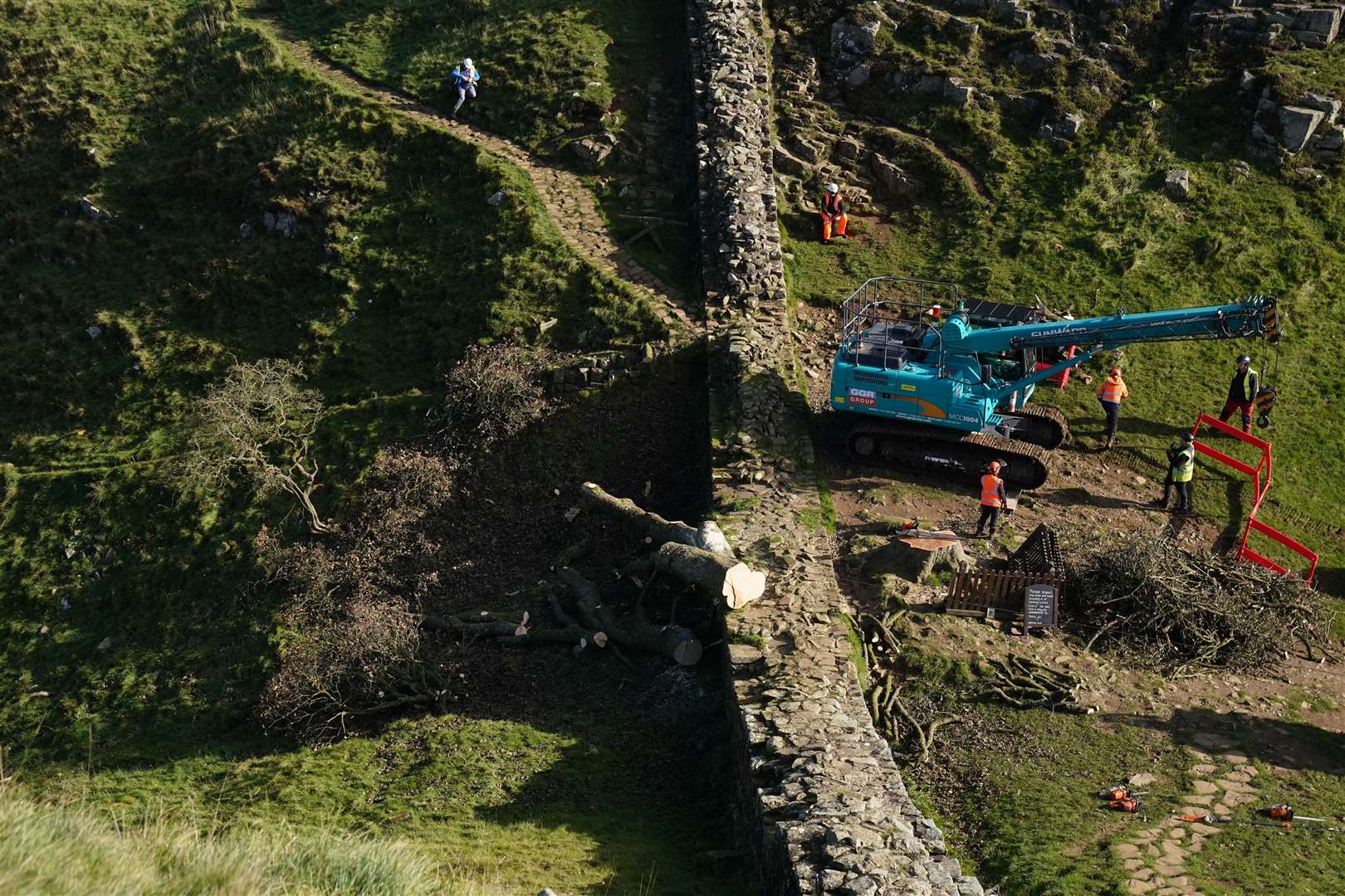 Work begins to remove the felled tree on Hadrian’s Wall in Northumberland in October last year (Owen Humphreys/PA)